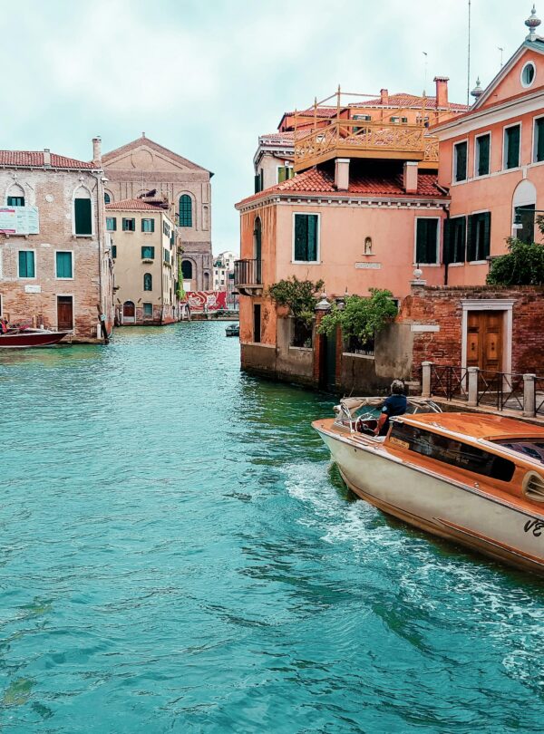 Picturesque view of Venice's canals with charming architecture and traditional boat.