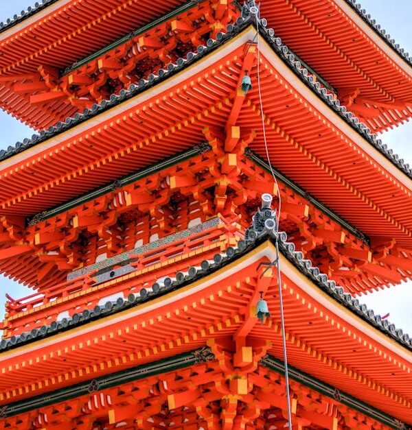 Vibrant pagoda at Kiyomizu-dera temple, a prominent landmark in Kyoto, Japan.