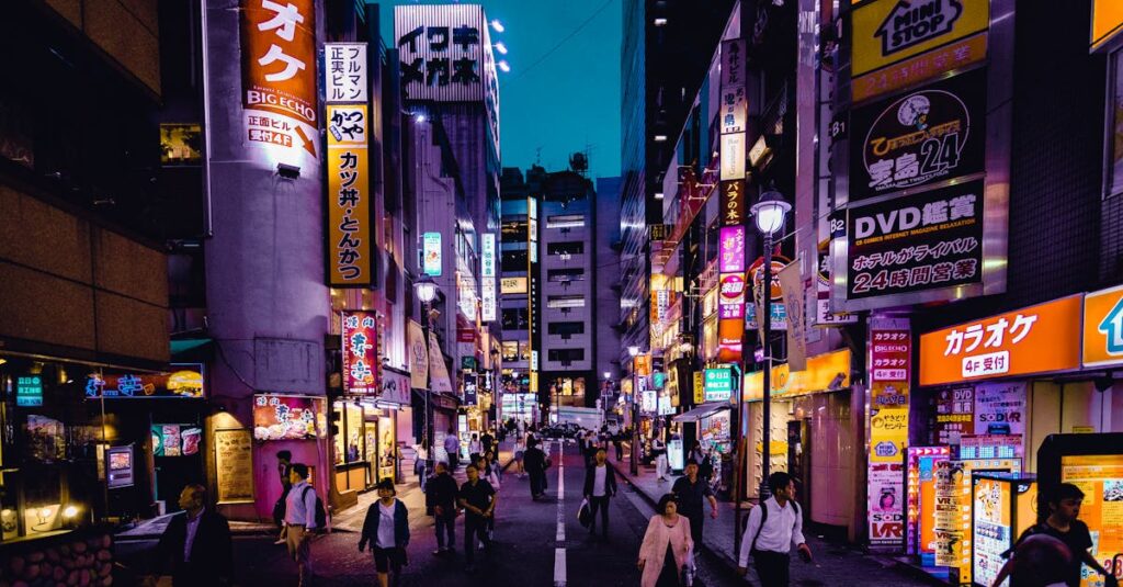 Explore the lively streets of Shinjuku, Tokyo at night with colorful lights and bustling activity.