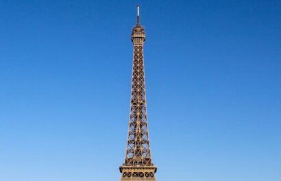 Stunning daylight shot capturing the Eiffel Tower with clear blue skies in Paris.