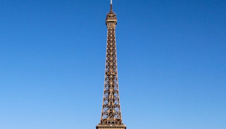 Stunning daylight shot capturing the Eiffel Tower with clear blue skies in Paris.