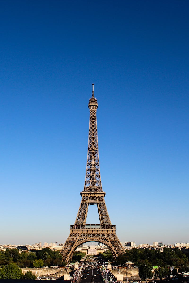 Stunning daylight shot capturing the Eiffel Tower with clear blue skies in Paris.