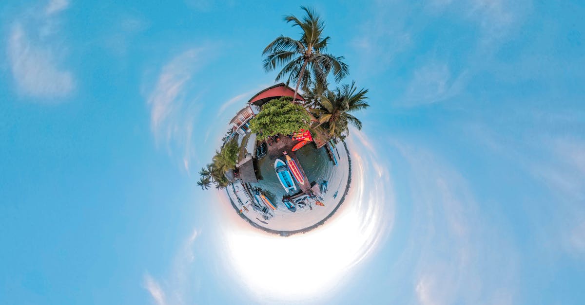 A creative tiny planet aerial view of a vibrant tropical beach scene surrounded by ocean, boats, and palm trees in Sri Lanka.